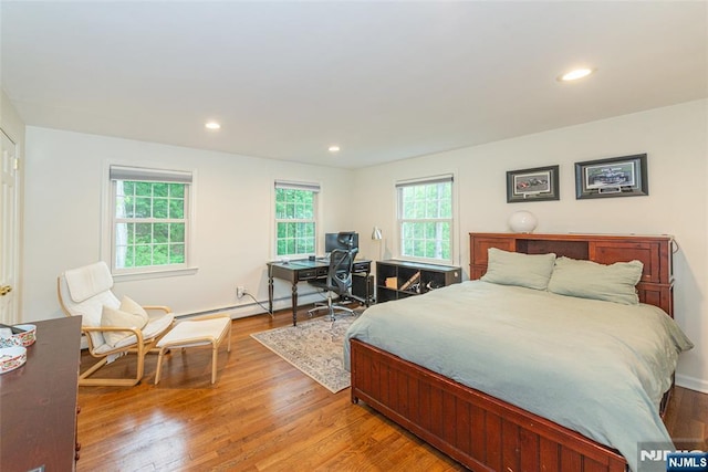 59 Green Hill Rd, Kinnelon Borough, NJ 07405 - bedroom with light wood-style floors, a baseboard radiator, and recessed lighting