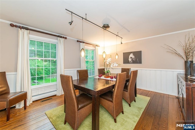 59 Green Hill Rd, Kinnelon Borough, NJ 07405 - dining room with hardwood / wood-style flooring, a wainscoted wall, rail lighting, ornamental molding, and a decorative wall