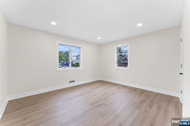 8 Marianne Ter, Secaucus, NJ 07094 - empty room with light wood-style flooring and recessed lighting