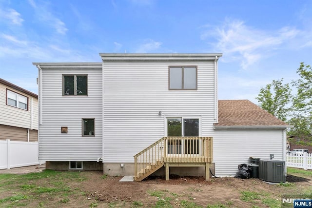 8 Marianne Ter, Secaucus, NJ 07094 - rear view of house featuring a shingled roof