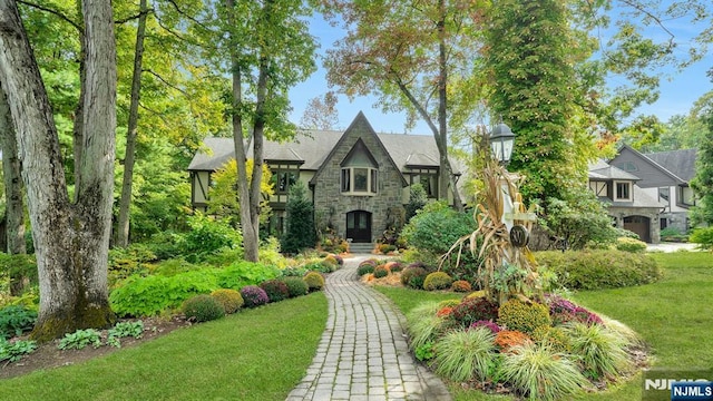 307 Freemans Ln, Franklin Lakes, NJ 07417 - tudor house with stone siding and a front yard