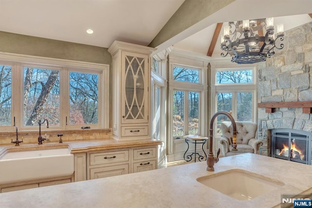 307 Freemans Ln, Franklin Lakes, NJ 07417 - kitchen with light countertops, a stone fireplace, a chandelier, and high vaulted ceiling