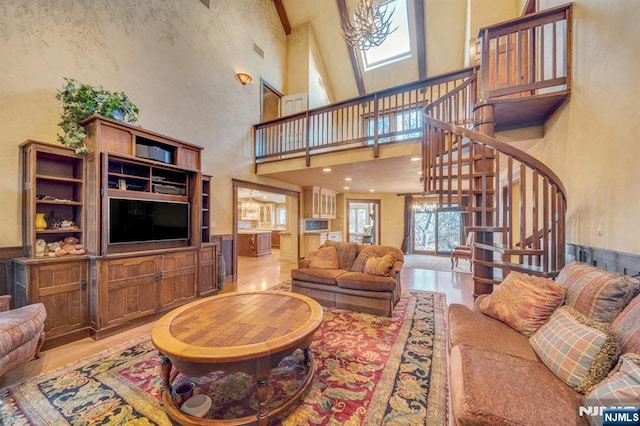 307 Freemans Ln, Franklin Lakes, NJ 07417 - living area featuring a high ceiling, stairway, and wainscoting