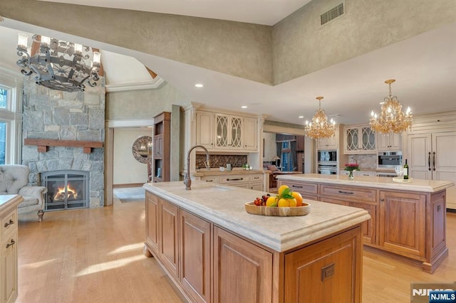 307 Freemans Ln, Franklin Lakes, NJ 07417 - kitchen with a center island with sink, a chandelier, light wood finished floors, light countertops, and recessed lighting
