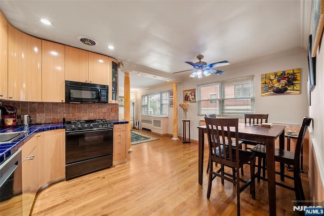 201 Oakdene Pl Unit C00E2, Cliffside Park, NJ 07010 - kitchen with black appliances, crown molding, tasteful backsplash, a ceiling fan, and light wood-type flooring