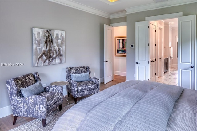 bedroom with ornamental molding and light wood-type flooring