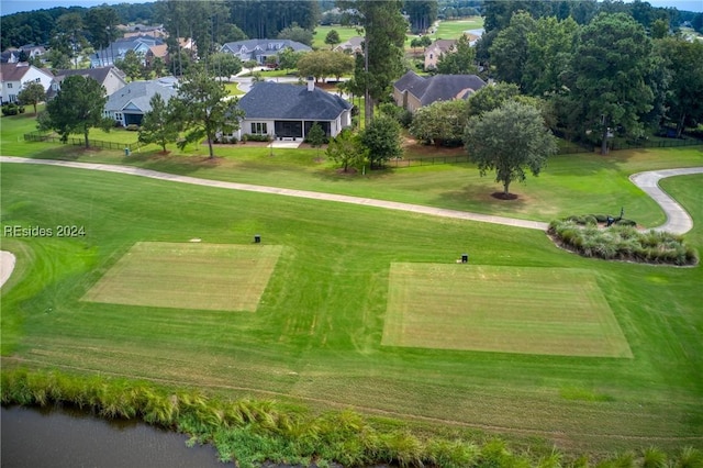 surrounding community with a water view