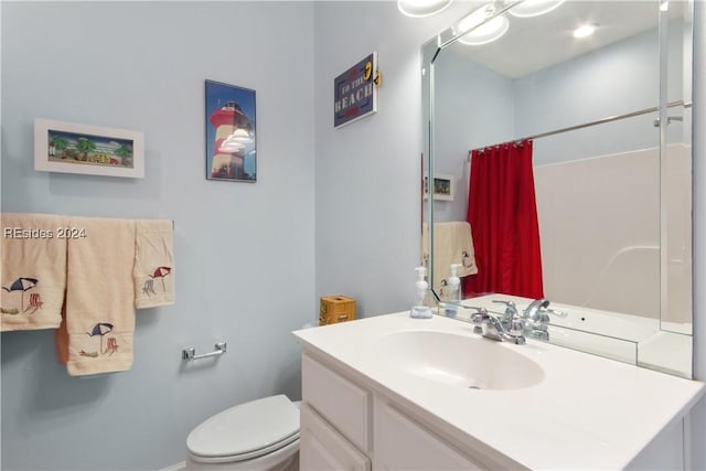 bathroom with a shower with curtain, vanity, and toilet