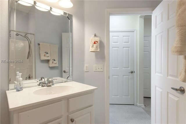 bathroom with vanity and tile patterned flooring