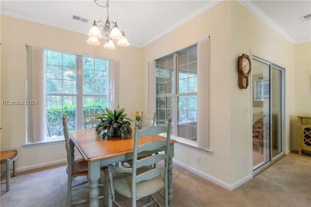 carpeted dining area featuring crown molding and a chandelier