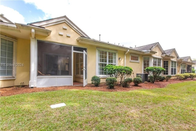 exterior space with a yard and central AC unit