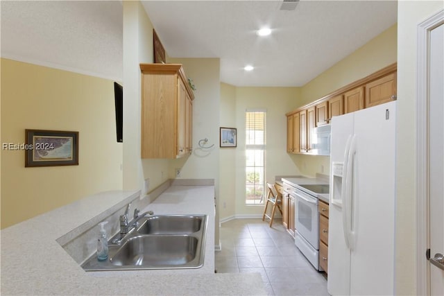 kitchen featuring white appliances, light tile patterned floors, sink, and light brown cabinets