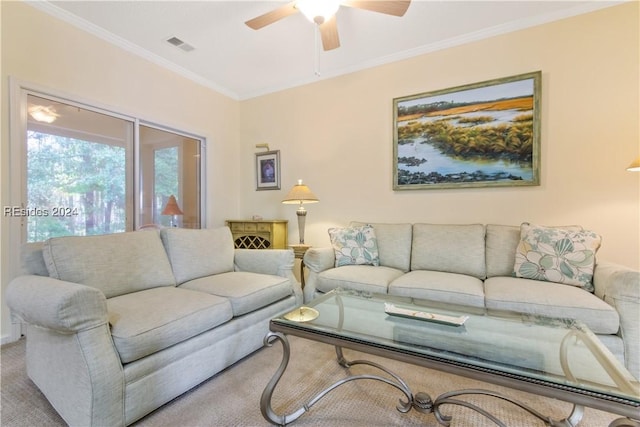 living room featuring crown molding, ceiling fan, and carpet