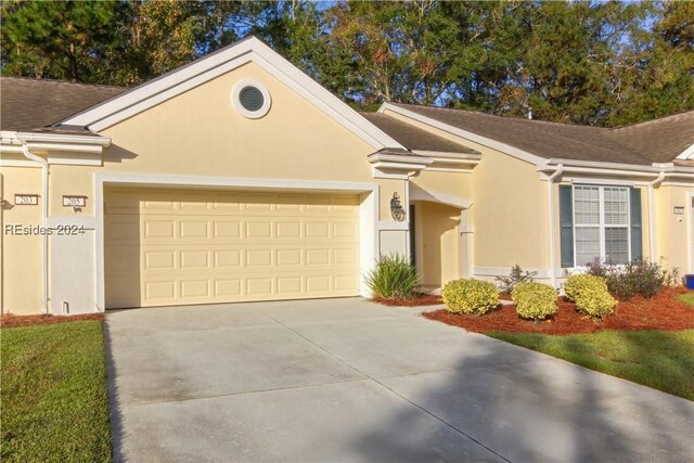 ranch-style house featuring a garage