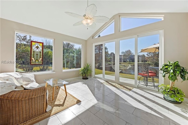 sunroom featuring a water view, ceiling fan, and lofted ceiling