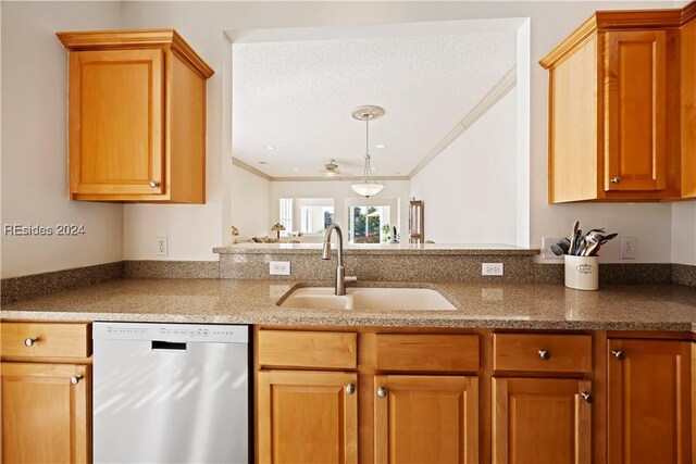 kitchen with crown molding, dishwasher, and sink