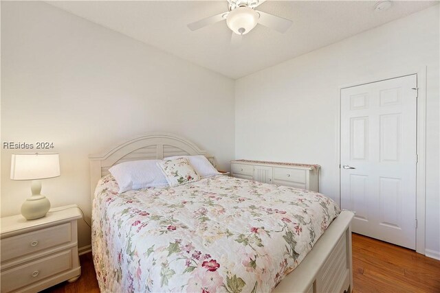 bedroom featuring hardwood / wood-style flooring and ceiling fan