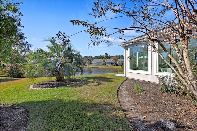 view of yard with a water view