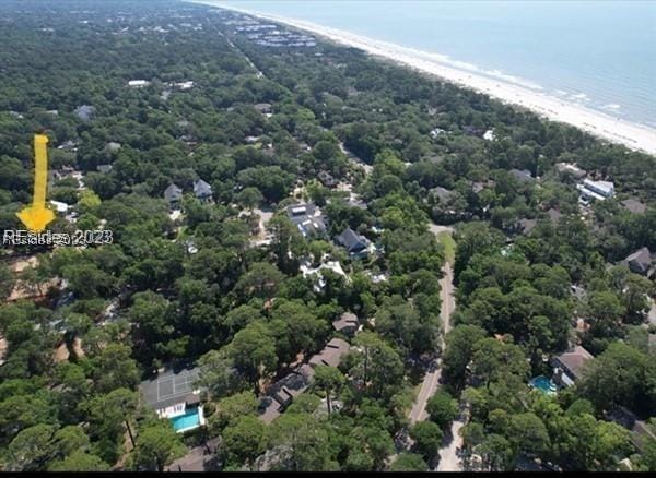 birds eye view of property with a view of the beach and a water view