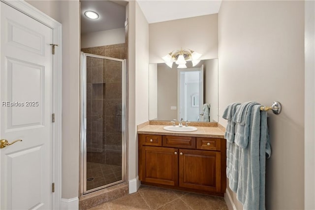 bathroom with vanity, an enclosed shower, and tile patterned flooring