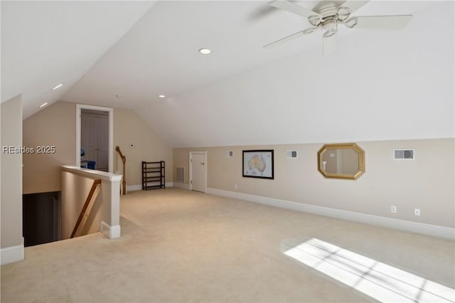 additional living space featuring light carpet and lofted ceiling