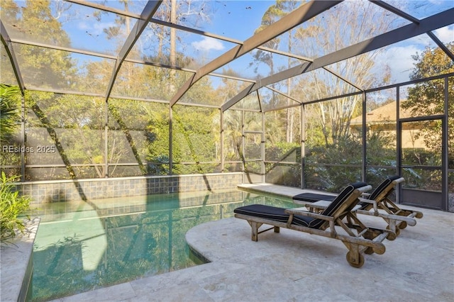 view of patio / terrace featuring a lanai