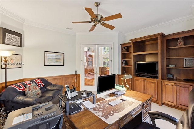 office with ceiling fan, ornamental molding, and wood walls