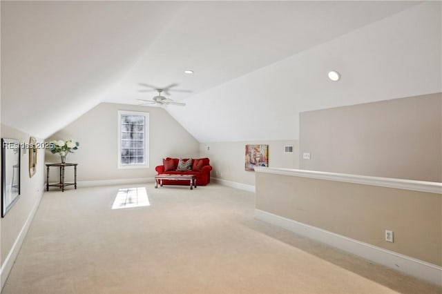 bonus room with vaulted ceiling, light colored carpet, and ceiling fan