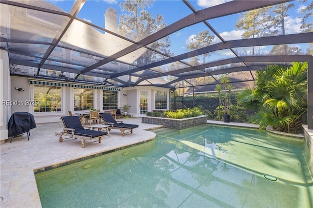 view of swimming pool with a patio area, grilling area, and glass enclosure