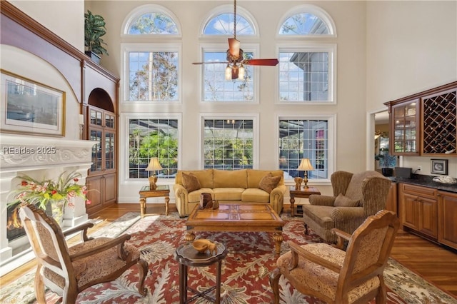 sunroom featuring indoor bar and ceiling fan