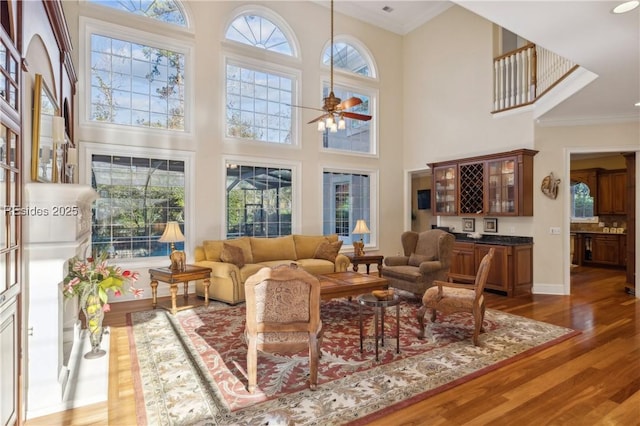 sunroom with ceiling fan and plenty of natural light