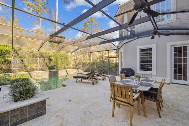 view of patio / terrace featuring a lanai and ceiling fan