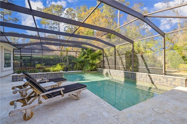 view of pool featuring a lanai and a patio area