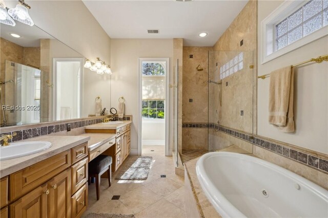 bathroom featuring tile patterned floors, vanity, and plus walk in shower