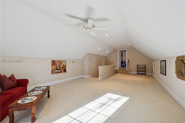 bonus room with vaulted ceiling, light colored carpet, and ceiling fan