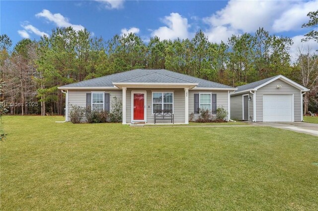 ranch-style house featuring an outbuilding, a garage, and a front yard