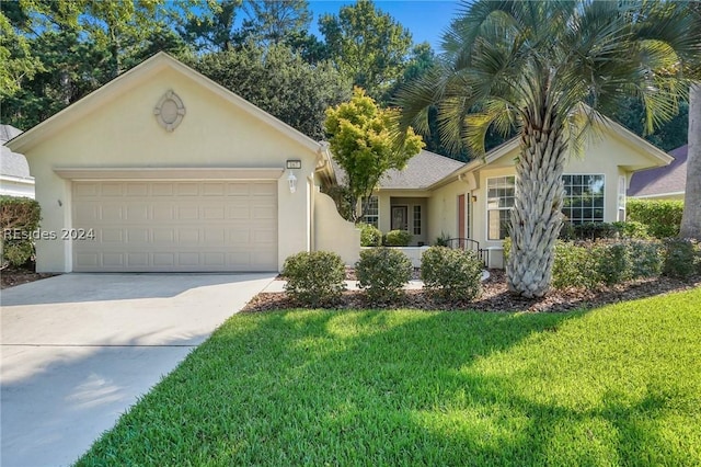 single story home with a garage and a front yard