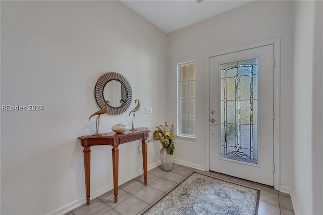 foyer entrance featuring light tile patterned flooring