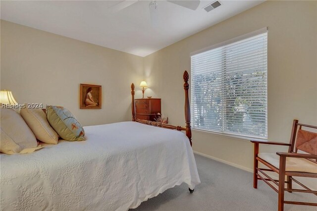 bedroom with ceiling fan and carpet flooring