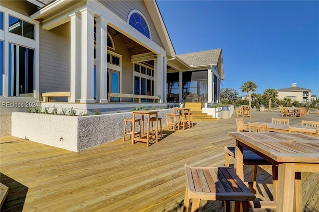 wooden deck with a bar