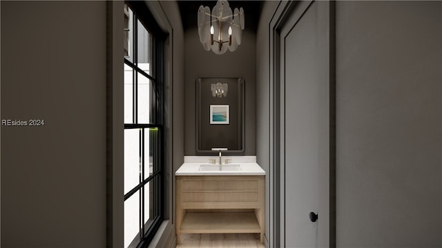 bathroom featuring vanity and a notable chandelier