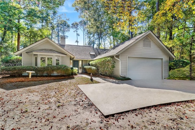 ranch-style home featuring a garage