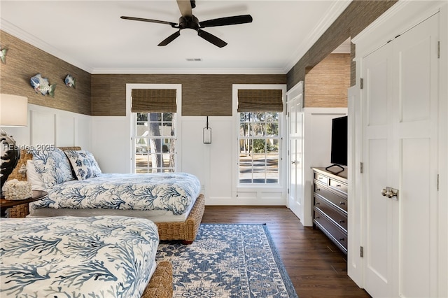 bedroom with ornamental molding, dark hardwood / wood-style floors, and ceiling fan