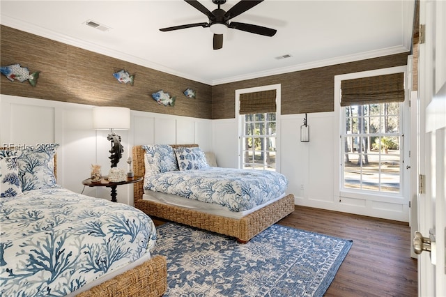 bedroom with multiple windows, crown molding, dark wood-type flooring, and ceiling fan