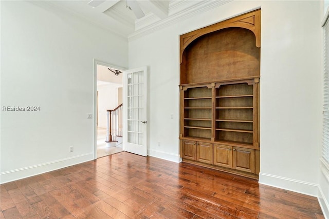 unfurnished room with coffered ceiling, ornamental molding, dark hardwood / wood-style flooring, beamed ceiling, and ceiling fan