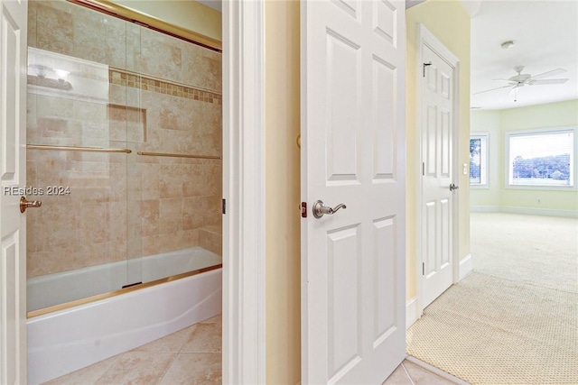 bathroom featuring bath / shower combo with glass door, tile patterned floors, and ceiling fan