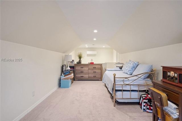 bedroom featuring a wall mounted air conditioner, vaulted ceiling, and light colored carpet