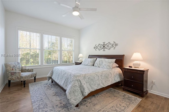 bedroom with ceiling fan and light hardwood / wood-style floors