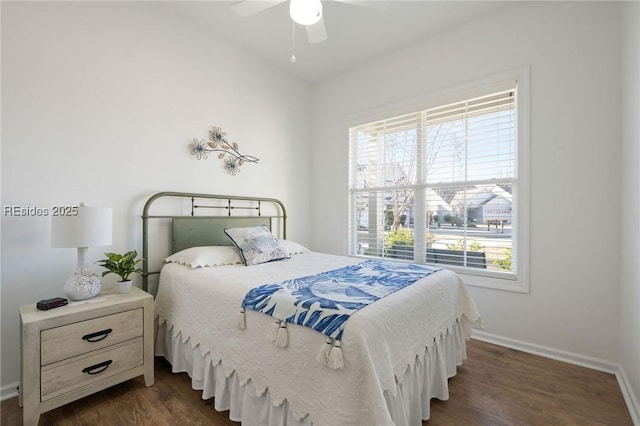 bedroom with multiple windows, dark hardwood / wood-style floors, and ceiling fan