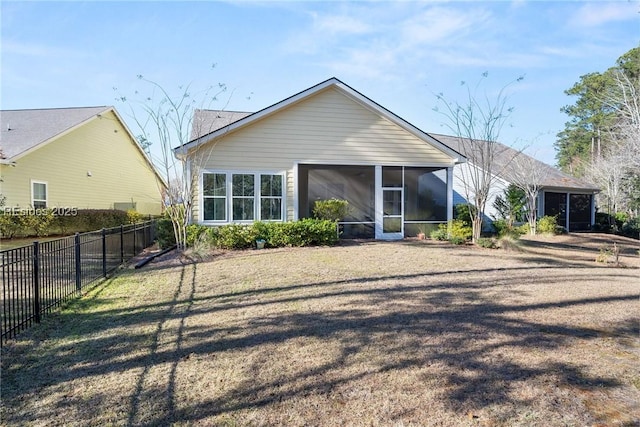 exterior space featuring a front lawn and a sunroom